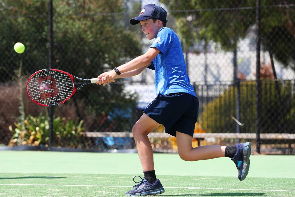 Angus Lee unleashes a forehand. Picture: Emma Hillier