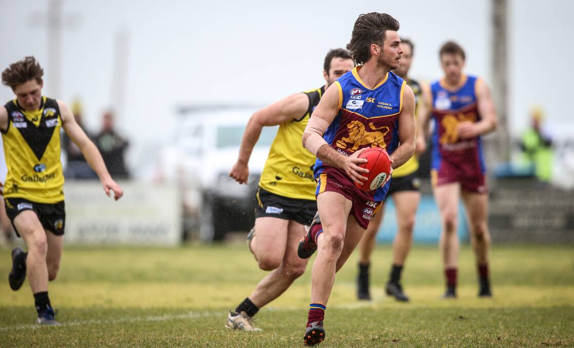 LIONS POUNCE: Ganmain-Grong Grong-Matong's Matt Neagle breaks away from the pack during Saturday's win at Osborne. Picture: James Wiltshire/The Border Mail