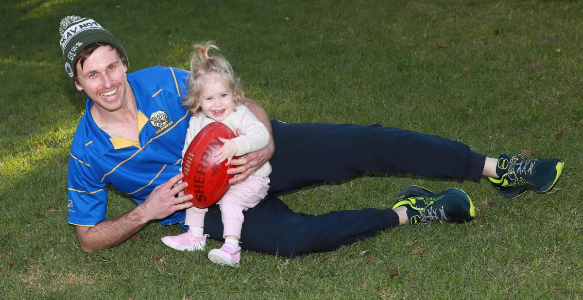 NEW ROLE: Mangoplah-Cookardinia United-Eastlakes' Ryan Price with daughter Matilda. Picture: Les Smith