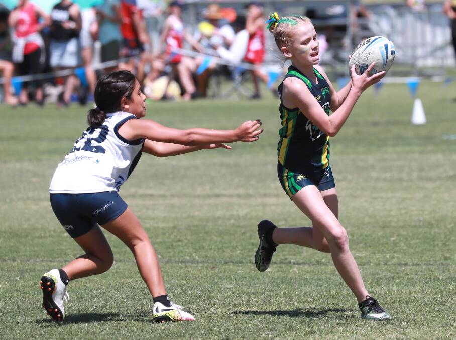 POSTPONED: Wagga's Abbey Hunt tries to evade a defender during last month's Junior State Cup Southern Conference carnival at Jubilee Park. Picture: Les Smith