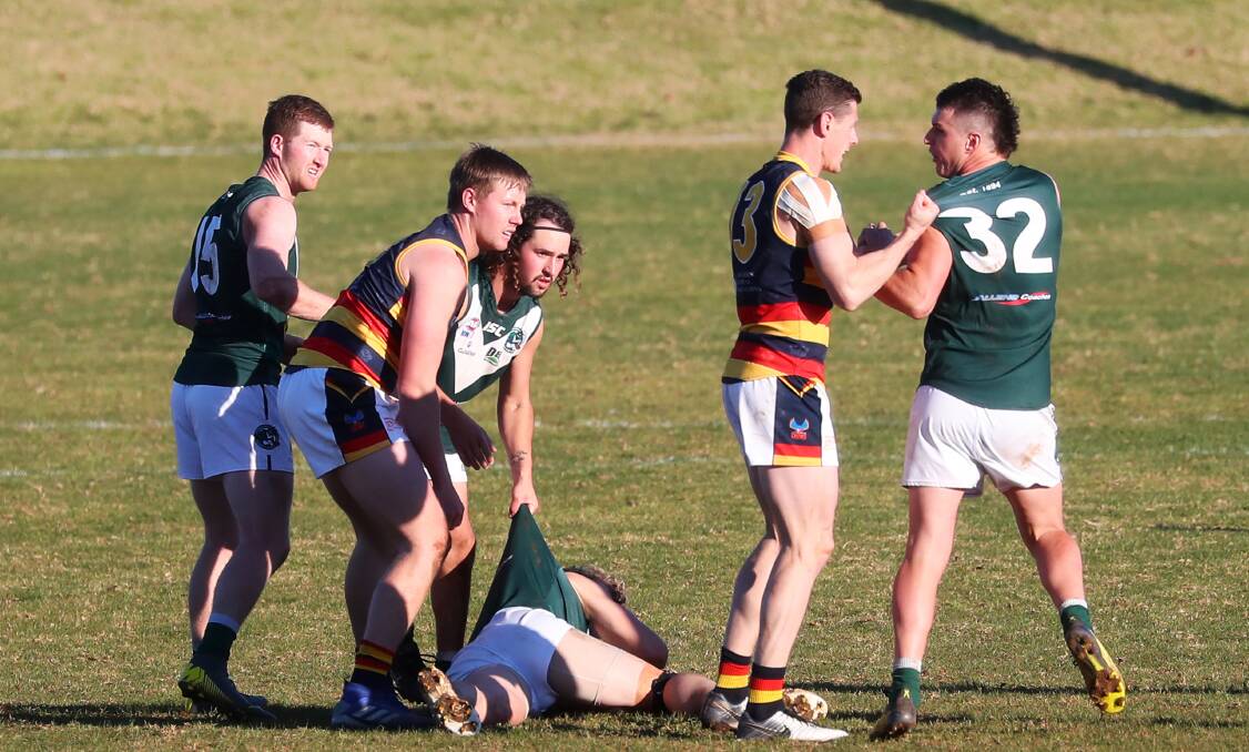 TENSE BATTLE: Leeton-Whitton coach Sam Darley goes toe-to-toe with Coolamon opposite number Jake Barrett last weekend. Picture: Emma Hillier