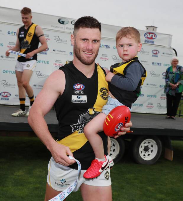 SOLDIERING ON: Brayden O'Hara with son Izaiah, three. Picture: Les Smith