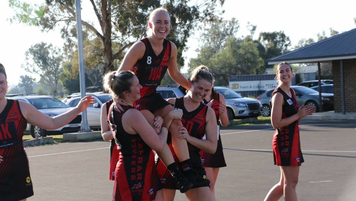 STALWART: Marrar's Tara Taylor is chaired off by teammates after her 250th game for the club on Saturday. Picture: Marrar Bombers 
