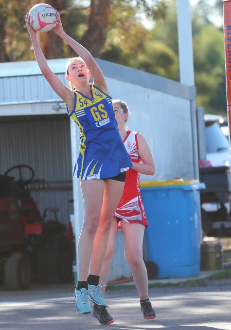 TALL TIMBER: MCUE goal shooter Katie Caller takes a pass during Saturday's one-goal loss to Collingullie-Glenfield Park. Picture: Emma Hillier