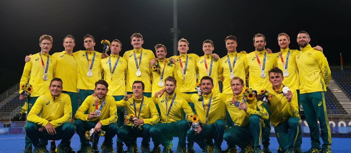 OLYMPIC MEDALLIST: Wagga's Dylan Martin (back, fourth from left)
with his silver medal after the Kookaburras' loss to Belgium in Thursday
night's final. Picture: AAP Images