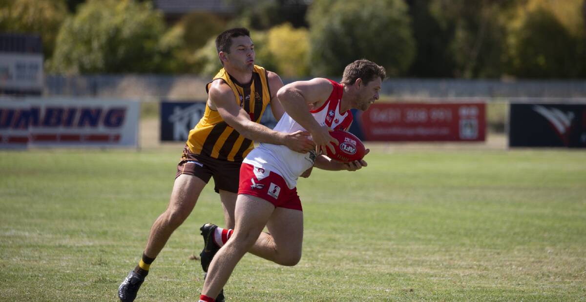 TRIAL TUSSLE: East Wagga Kooringal's Nick Curran tackles Griffith's James Toscan in Saturday's trial clash at Gumly Oval. Picture: Madeline Begley 