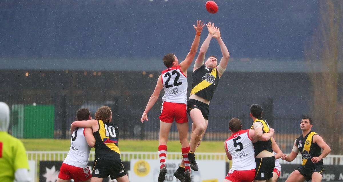 IN DOUBT: Wagga Tigers ruckman Tom Osmotherly (right) in a ruck duel with Griffith's Riley Irvin last year. 