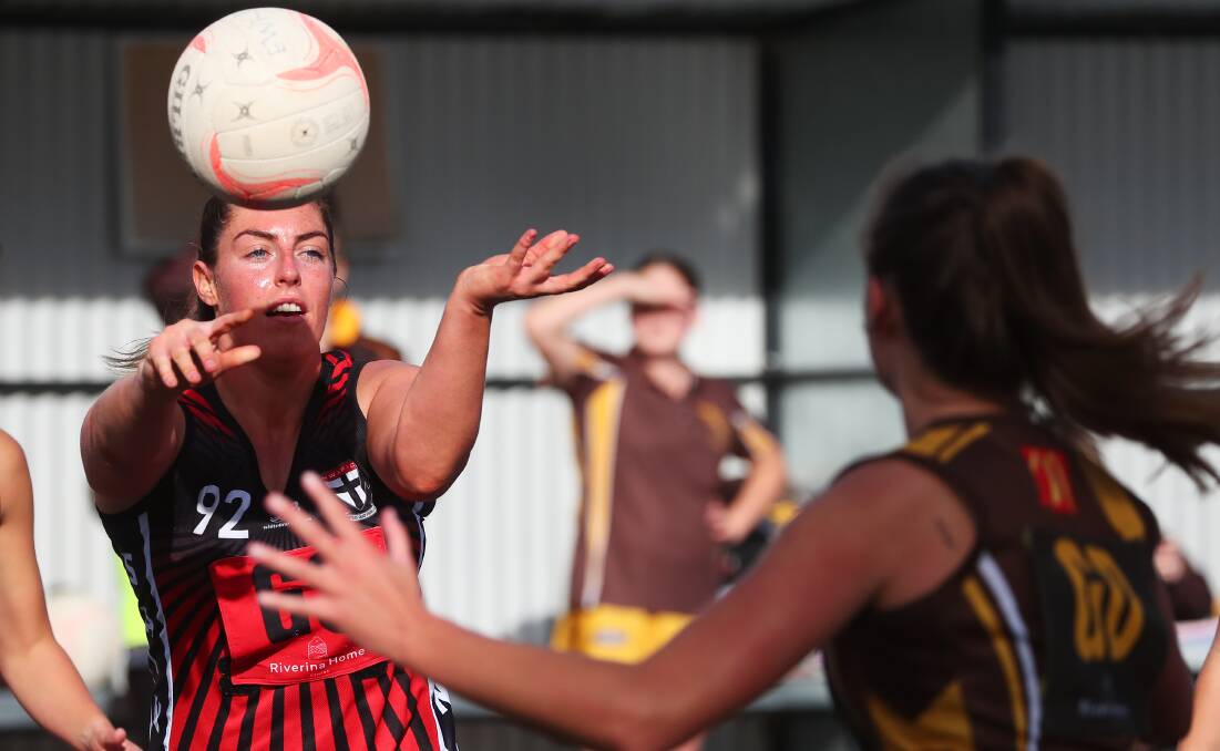 STRONG WIN: North Wagga's Lily Wild gets a pass away during Saturday's win over East Wagga Kooringal. Picture: Emma Hillier