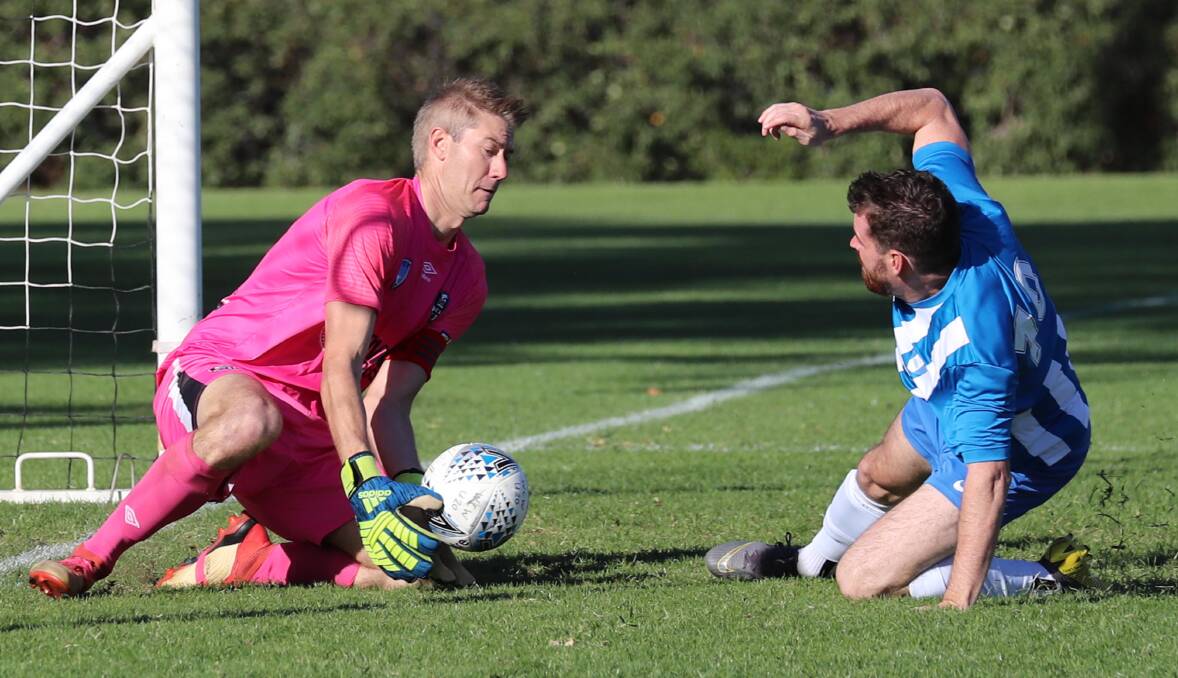 CONFIDENT: Wagga City Wanderers goalkeeper Robert Fry makes a save last season. 