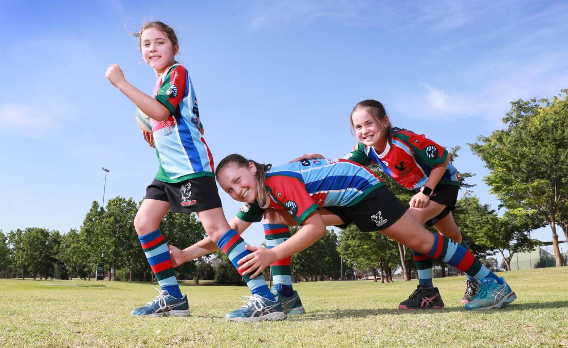 TACKLE TIME: Wagga Crows players Paige Dean, eight, Addison Dean, 11 and Georgie Hayes, 11 are looking forward to the introduction of tackle competitions for girls next year in Southern Inland Rugby Union. Picture: Les Smith