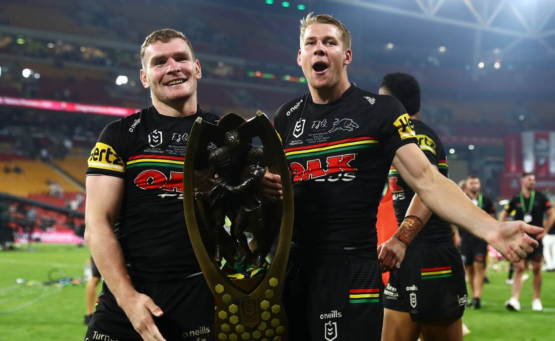 MISSION ACCOMPLISHED: Temora product Liam Martin (left) and Penrith teammate Matt Burton after Sunday night's grand final win over South Sydney. Picture: Chris Hyde/Getty Images
