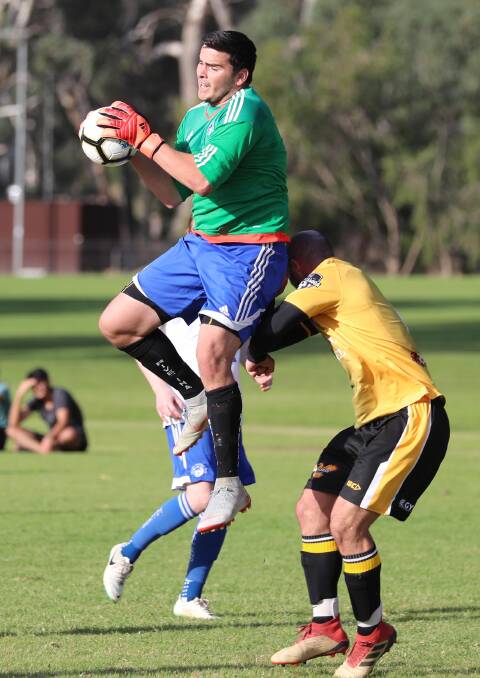 Tolland keeper Brandon O'Brien takes a catch during Sunday's game against Tumut.
