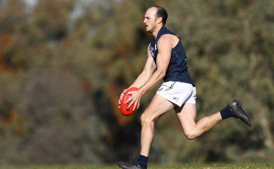 BACK AT LIONS: Curtis Steele in action for Coleambally Blues last year. Steele is playing for former side Ganmain-Grong Grong-Matong this season in the AFL Riverina Championship. 