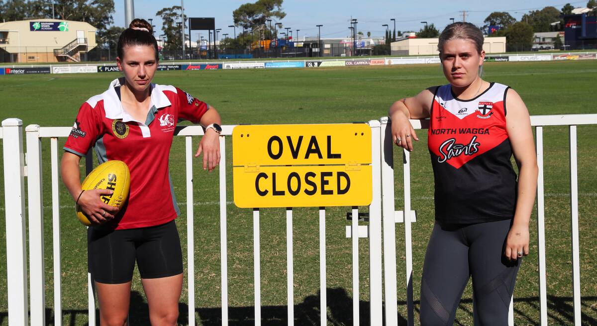 FOOTY'S OFF: CSU's Gabrielle Goldsworthy and North Wagga's Nat Creed. Picture: Emma Hillier
