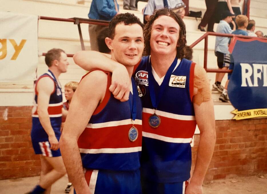 BROTHERS IN ARMS: Blair Campbell (left) and brother Dane after Turvey Park's 2002 grand final win. 
