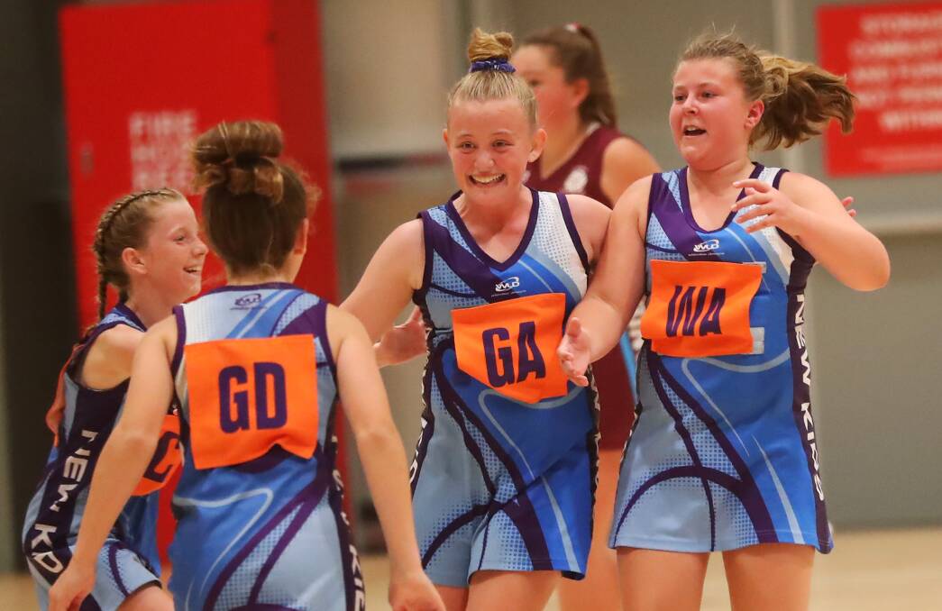 WINNERS: New Kids Bluebirds players celebrate after beating Kooringal Maroon in the 12 Years division one grand final. Picture: Emma Hillier