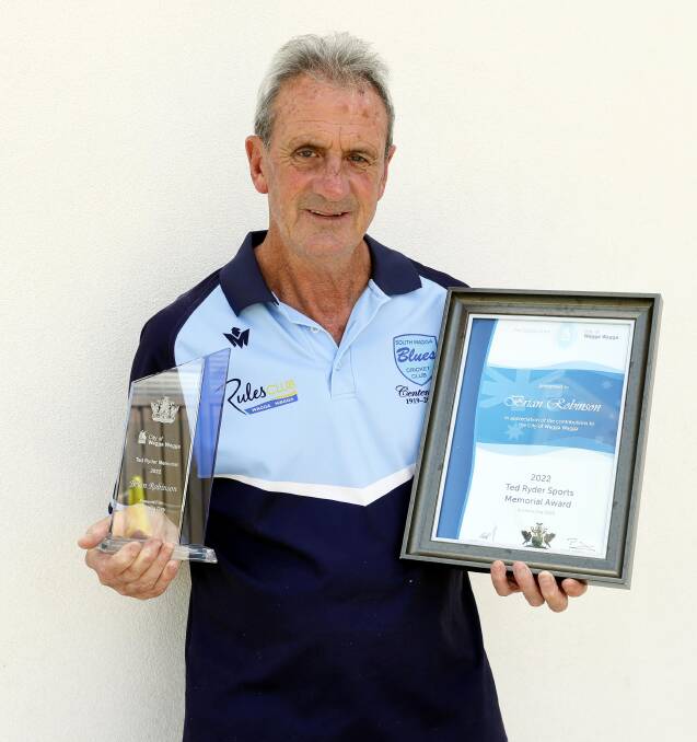 Brian Johnson with his awards. Picture: Les Smith