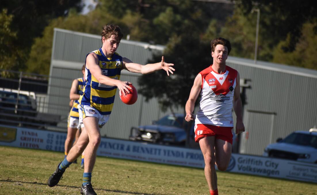 JOB DONE: MCUE's Ethan Schiller gets a kick during Saturday's win at Griffith. Picture: Liam Warren