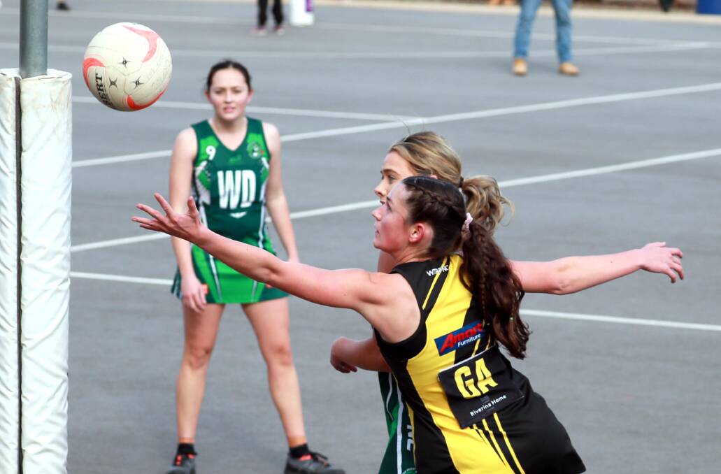 HOPPERS SURGE: Wagga Tiger Eliza Kelly grapples for the ball during Sunday's loss to Coolamon. Picture: Les Smith