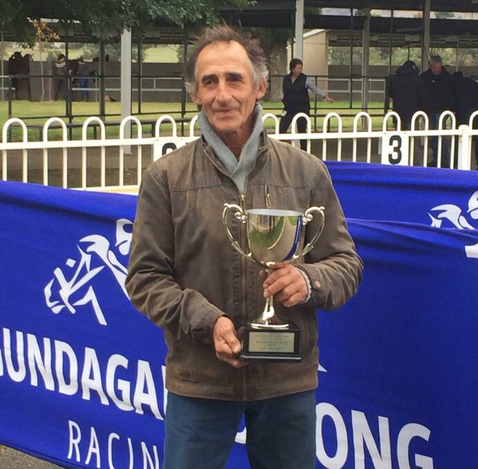 LOCAL WIN: Trainer David Blundell with the Gundagai Cup after Monkery caused a boilover on Sunday. Picture: Supplied