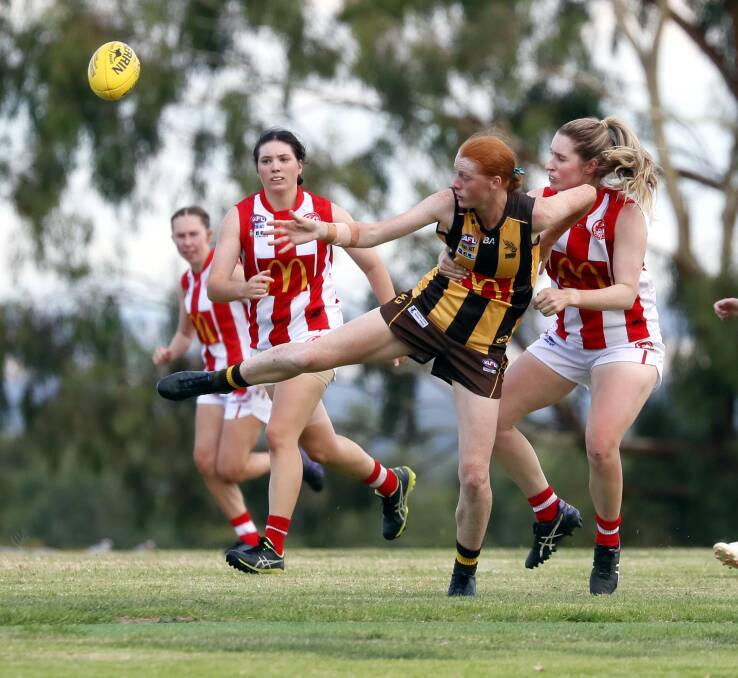 OFF THE MARK: East Wagga Kooringals' Sophie Crouch gets a kick away under pressure during the Hawks' win over CSU on Friday night. Picture: Les Smith
