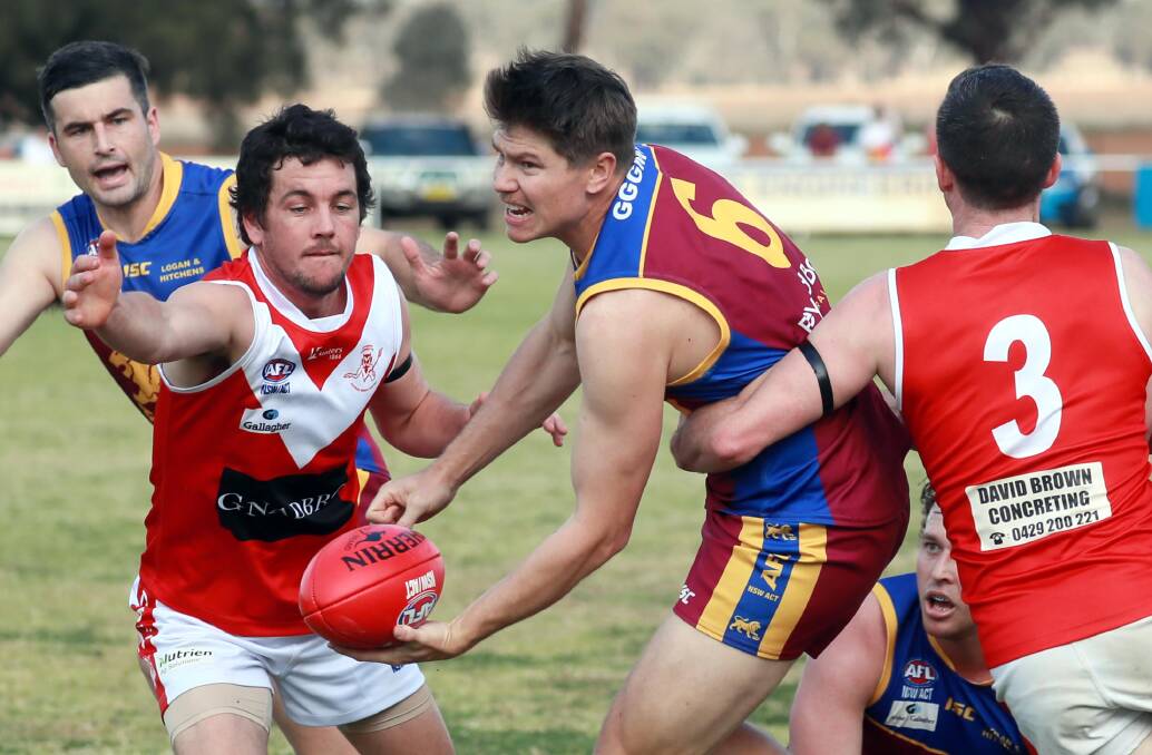 TOO STRONG: Ganmain-Grong Grong-Matong's Lachlan Parker gets a handball away against Collingullie-Glenfield Park. Picture: Les Smith