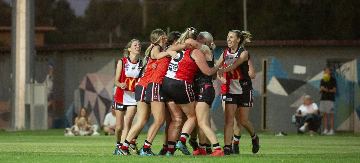YOU BEAUTY: North Wagga players celebrate after
Skye Davey's late goal clinched victory in Friday's
preliminary final against Collingullie-Glenfield Park
Picture: Madeline Begley