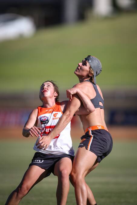 Jodie Hicks grapples with a Giants teammate at training. Picture: James Wiltshire/The Border Mail 