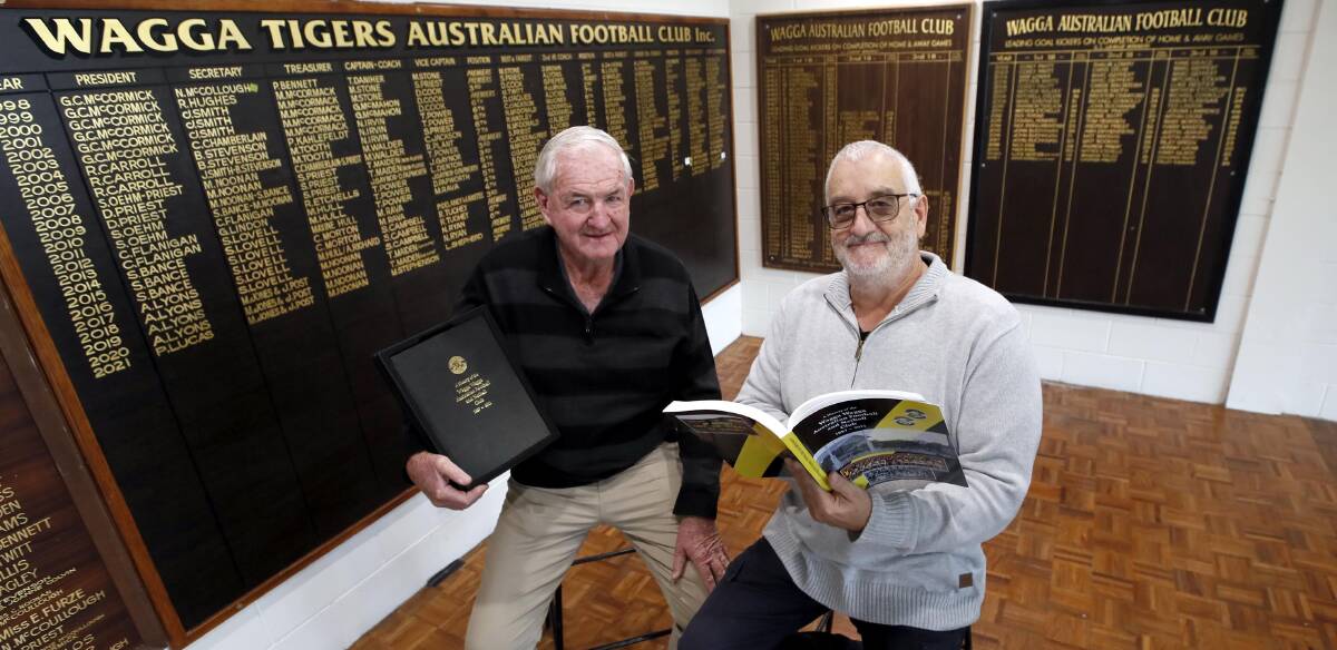 HISTORY BUFFS: Doug Priest and John Smith have helped compile a book detailing Wagga Tigers' 134-year history. Picture: Les Smith