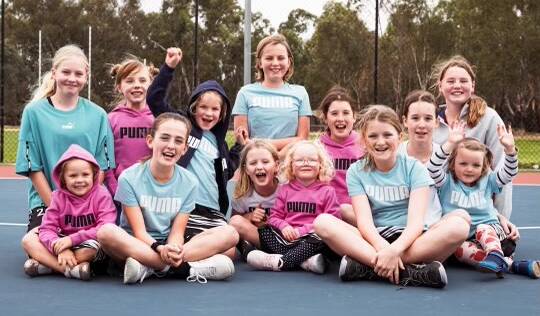 Hazel with her netball friends. Picture: PUMA