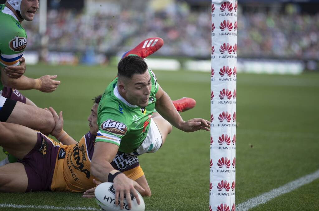 ROOKIE RAIDER: Nick Cotric scores a try against the Broncos earlier this season. Picture: Sitthixay Ditthavong.