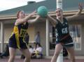 FINAL BOUND: The Riverina Anglican College captain Sarah Croker (right) jostles with Kooringal High's Maddie Priest during Tuesday's Tracey Gunson Shield semi finals. Picture: Madeline Begley
