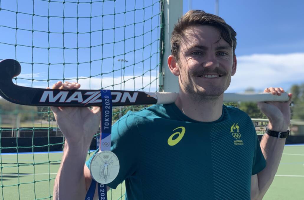 SILVER LINING: Wagga product Dylan Martin shows off the silver medal he won with the Kookaburras at this year's Olympics. Picture: Jon Tuxworth
