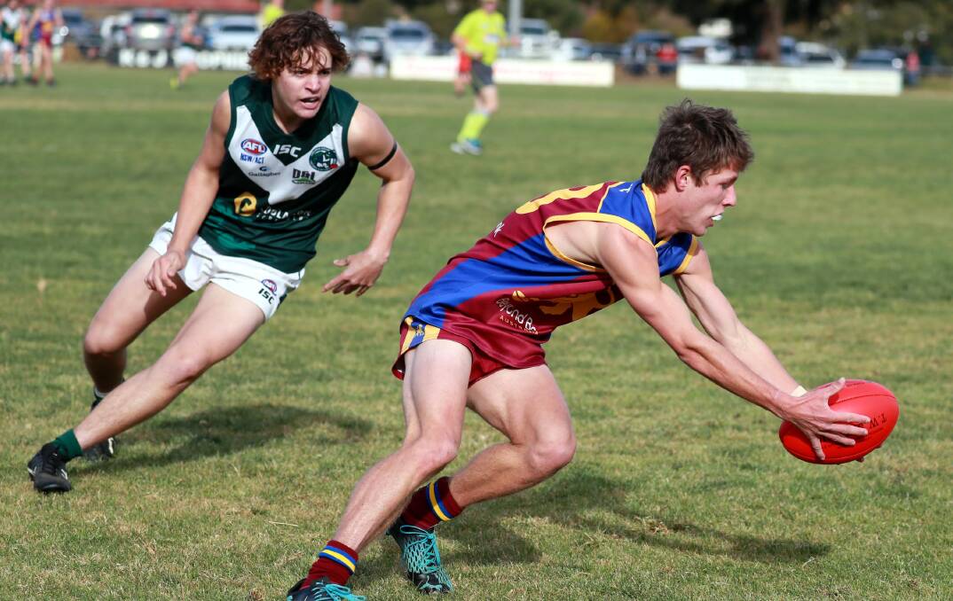 BAD TIMING: Ganmain-Grong Grong-Maton'gs Jakob Taylor gathers the ball in front of Coolamon's Bayden Leary during their clash at Ganmain earlier this year. Picture: Les Smith 