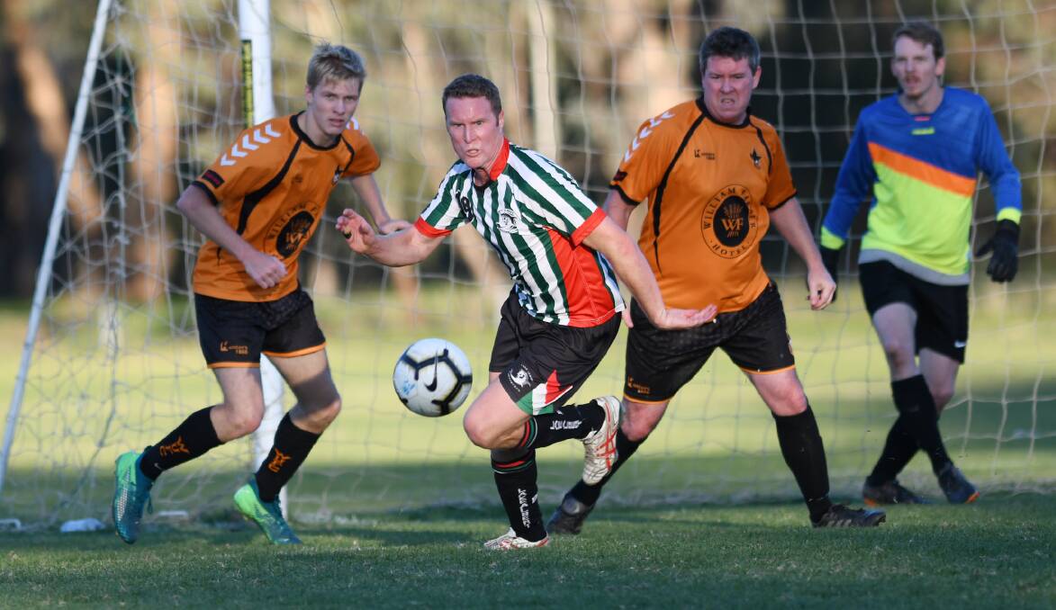 SOLID WIN: Lake Albert's Duncan Brodie contests the ball during his side's 2-1 win over Wagga United on Sunday. 