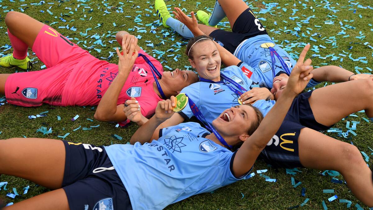 WAGGA BOUND: Sydney FC players celebrate after winning the W-League grand final in February. Picture: AAP Image/Dan Himbrechts
