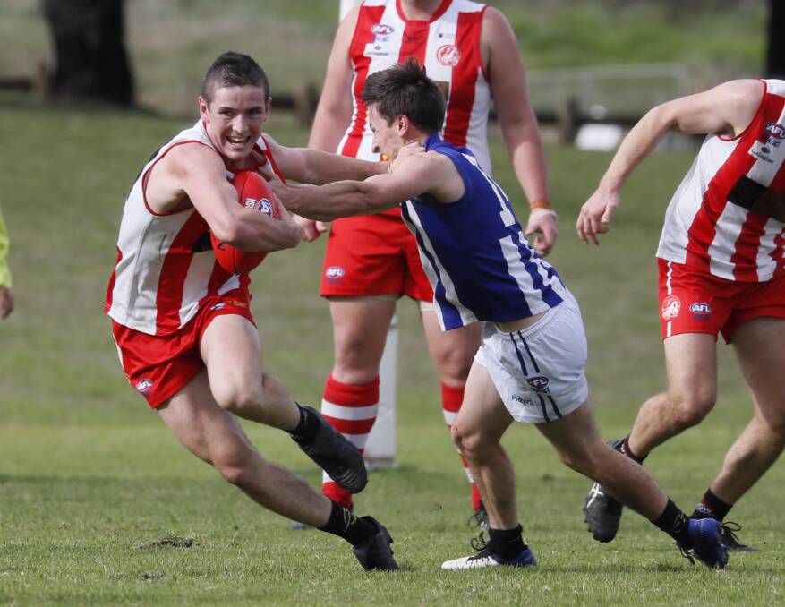 VICTORY: CSU's Max Findlay tries to fend off a defender during their win over Temora. Picture: Les Smith