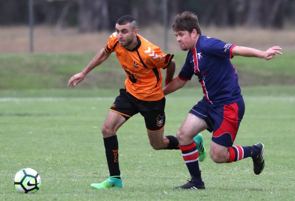 LATE BRACE: Two late goals from Nazar Yousif (left, pictured playing against Henwood Park last year) salvaged a draw for Wagga United against Tumut. Picture: Les Smith.