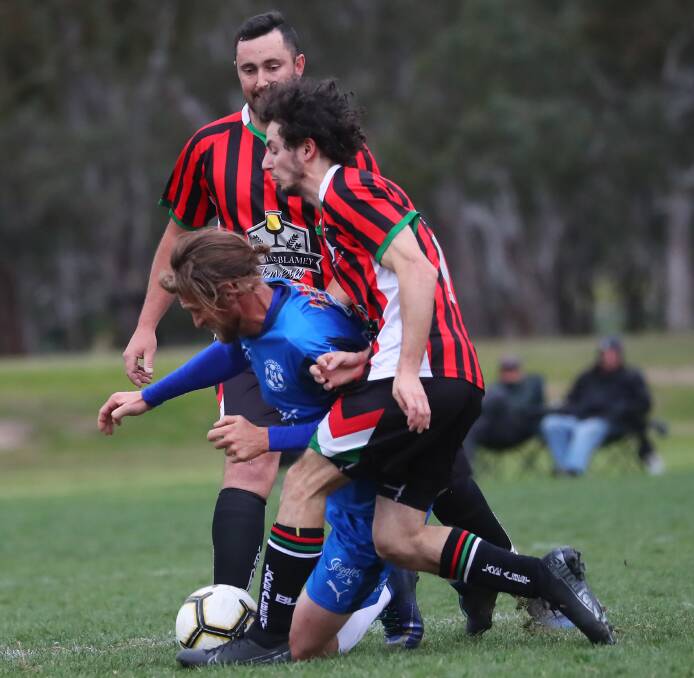 PHYSICAL BATTLE: Hanwood's Sevi Tropea and Cam Mavor during Sunday's Pascoe Cup major semi final. Picture: Emma Hillier