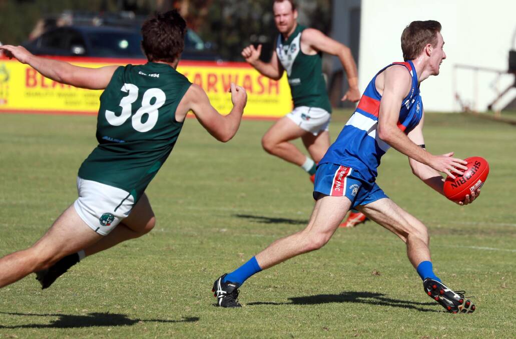 TIME TO RESPOND: Turvey Park's Billy Glanvill gets a handball away against Coolamon in round one. Picture: Les Smith