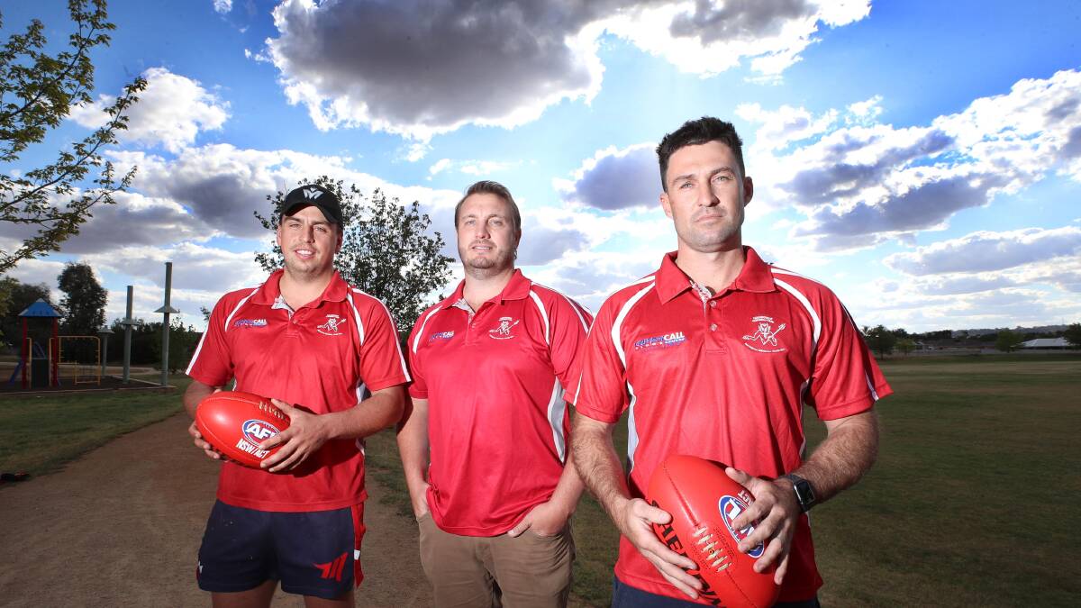 NO FOOTY: Collingullie Glenfield Park player Ned Mortimer and Ben Absolum with Collingullie coach Brett Sommerville. The Demons have announced they won't play this season. Picture: Les Smith
