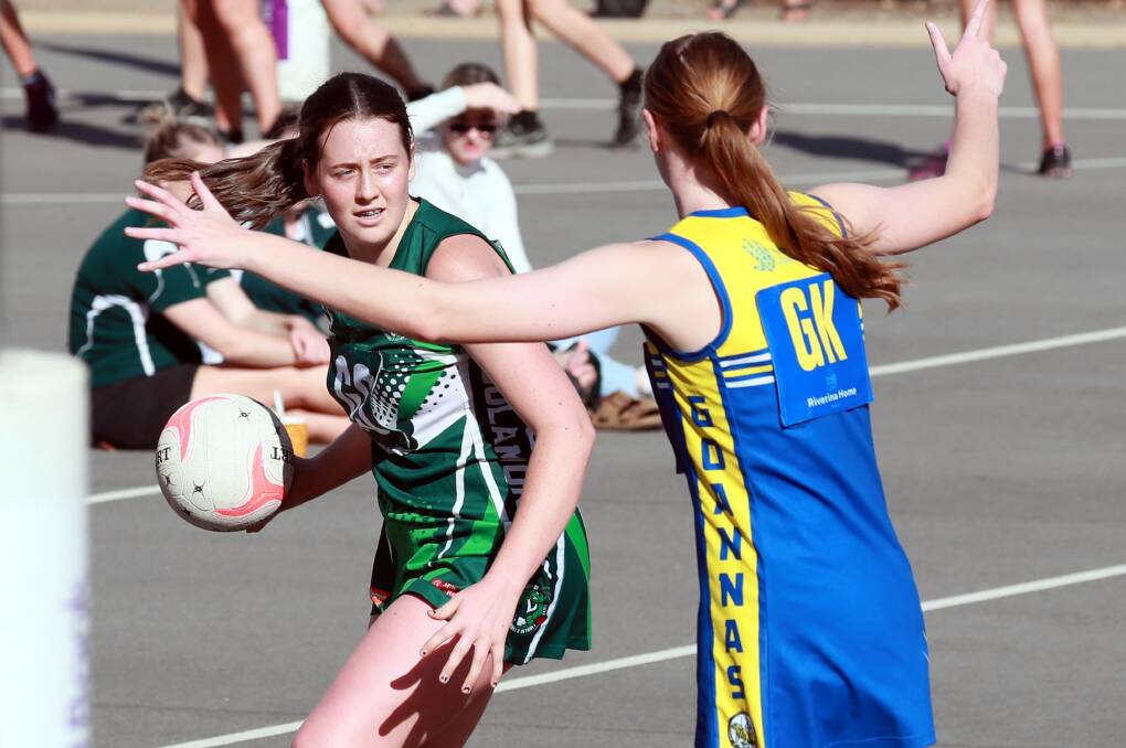 ASSESSING OPTIONS: Coolamon's Lilly Buchanan looks to make a pass during Sunday's clash with MCUE. Picture: Les Smith