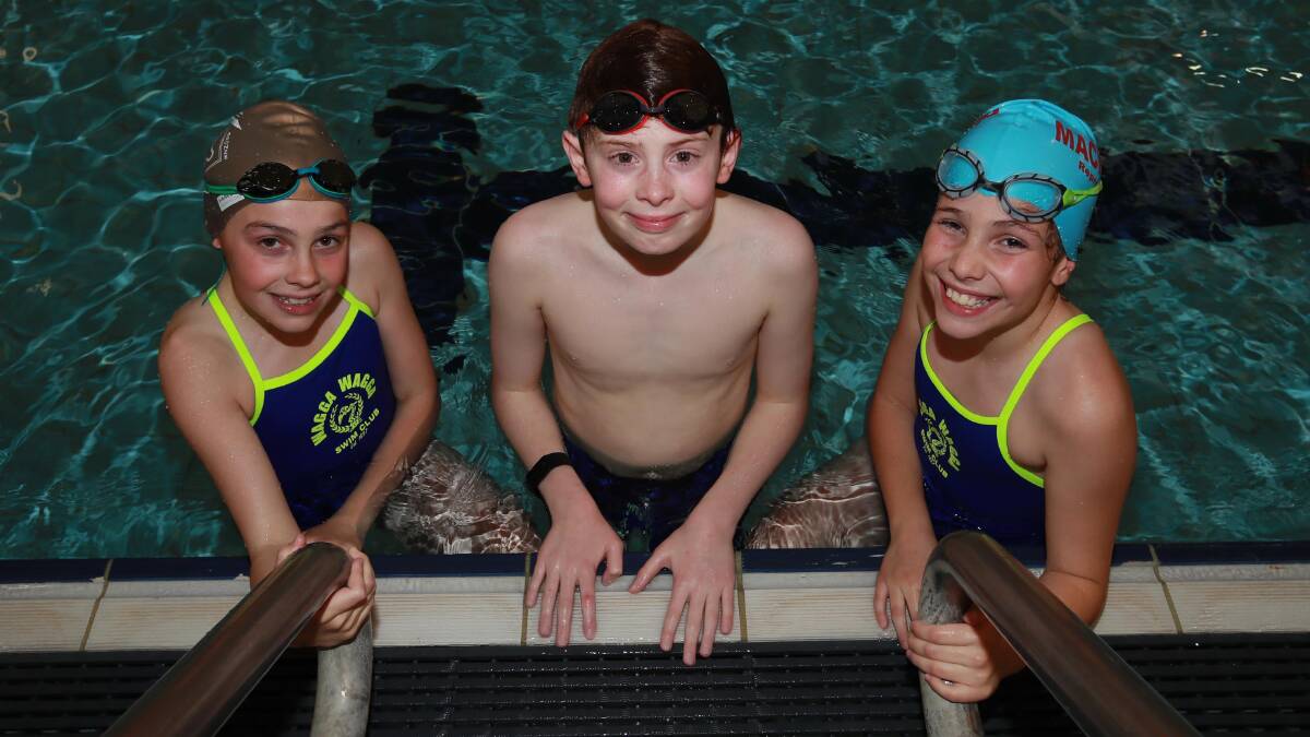 MAKING A SPLASH: Wagga Swim Club members Neve Scholz, 12, Sebastian Farrow, 12 and Alana Scholz, 10 at training on Wednesday. Picture: Les Smith