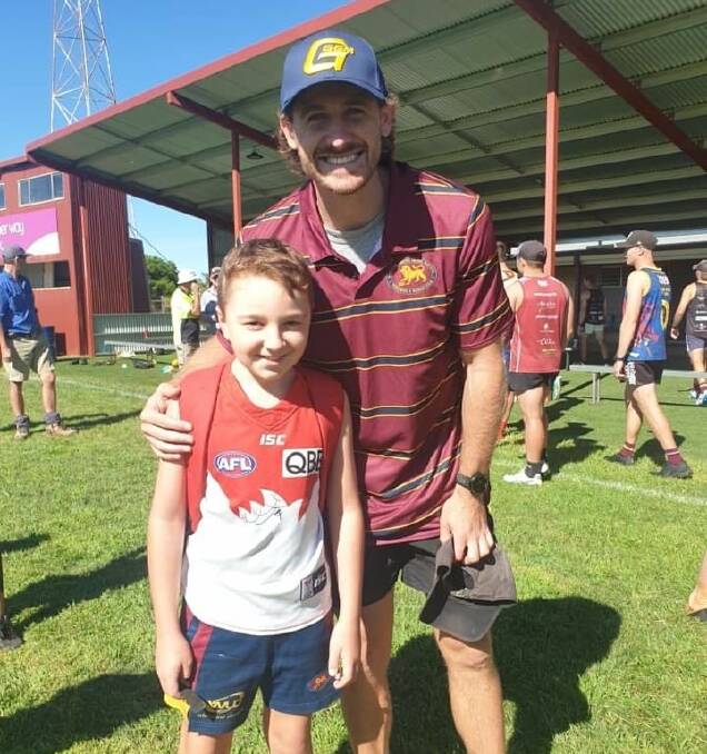 UP CLOSE: Young Sydney Swans fan Liam Quinn meets Swans star Harry Cunningham at GGGM training on Saturday. Picture: GGGM Lions