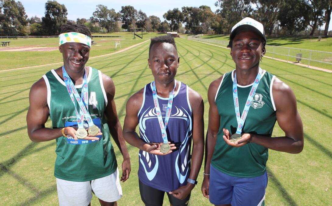 BIG POTENTIAL: Godfrey Okerenyang, Kippy Langat and Gerard Okerenyang dominated their events at last week's NSW All Schools Championships in Sydney. Picture: Les Smith