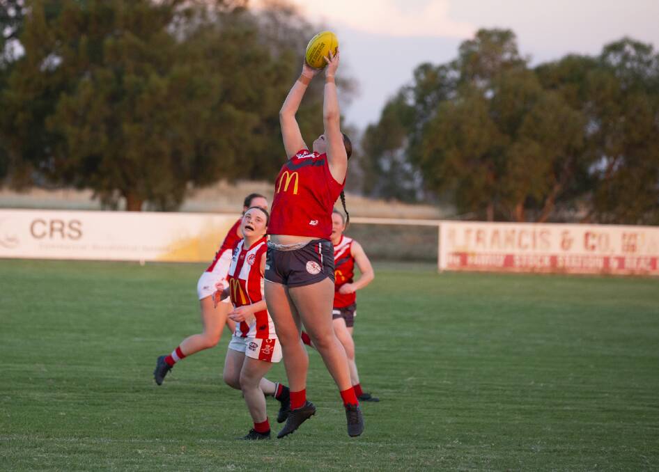 UP THERE: Collingullie-Glenfield Park's Tayla Harmer takes a mark during last week's semi win over CSU. Picture: Madeline Begley