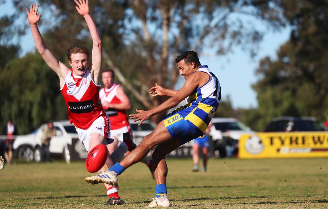 FOOTY'S BACK: Mangoplah-Cookardinia United-Eastlakes' Wesley Clark gets a kick away against Collingullie-Glenfield Park last year. Picture: Les Smith
