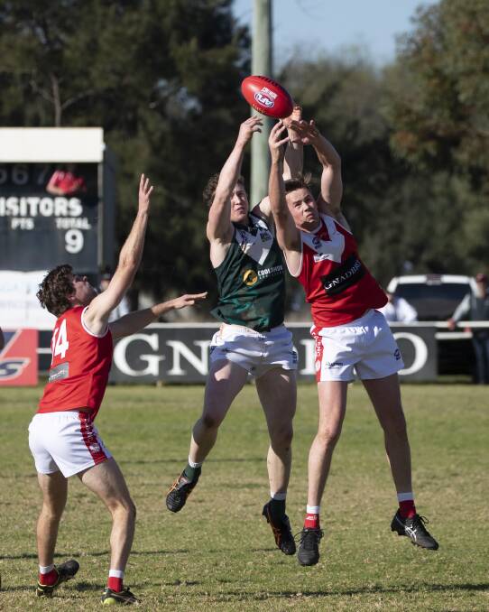 The Demons and Hoppers played out a draw. Pictures: Madeline Begley