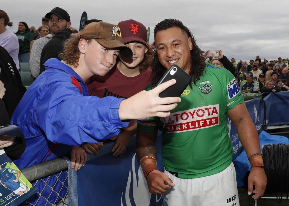 HAPPY SNAP: Canberra Raiders cult hero Josh Papalii poses for a selfie with fans at Saturday's NRL clash in Wagga. Picture: Les Smith