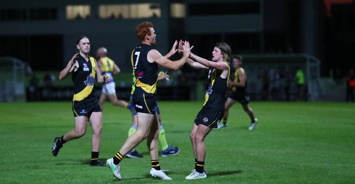 FORGETTABLE NIGHT: Murray Stephenson is congratulated after kicking a goal against MCUE, but it was a night to forget for Wagga Tigers. Picture: Emma Hillier